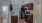 a kitchen with wooden cabinets